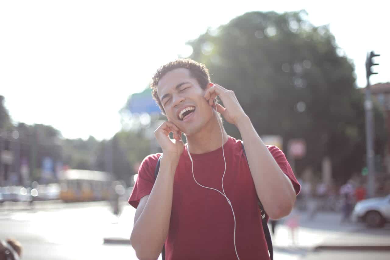 Man listening to music through headphones.